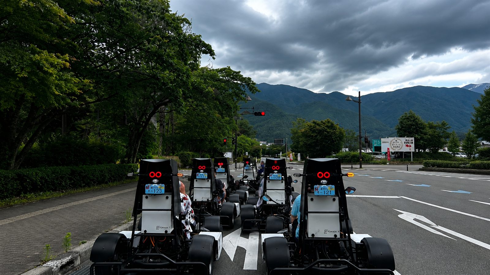 Go-kart convoy heading toward the mountains